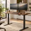 Electric Standing Desk — Primary Walnut electric standing desk with black frame in a home office