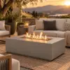 Modern propane fire pit table in a styled patio setting