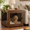 Walnut dog crate end table beside a sofa with a dog inside